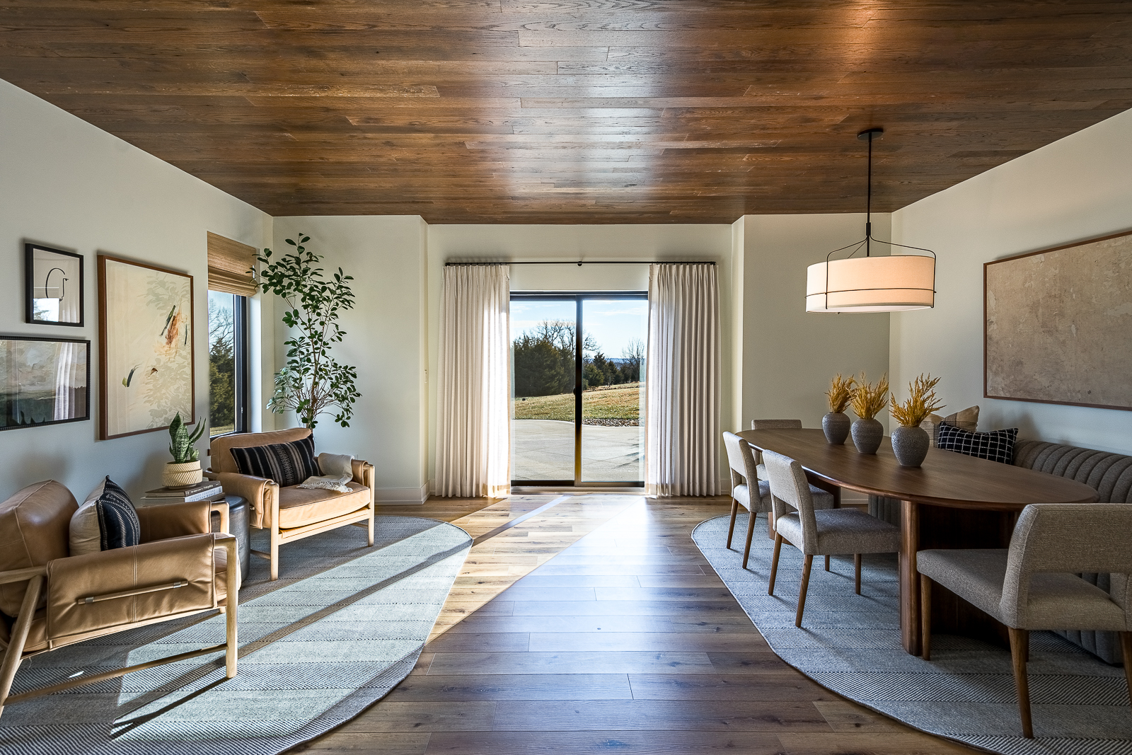 wide-angle view of the lower level seating and dining areas in the Haven custom home project.